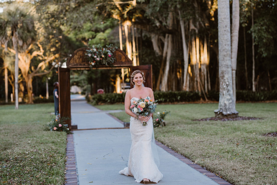 Outdoor Ceremony Bridal Portrait with Rustic Antique Wooden Door Gate, White and Peach Rose Bouquet with Greenery, wearing Casablanca Sweetheart Mermaid Wedding Dress | Sarasota Wedding Venue The Ringling