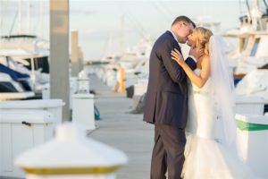 Outdoor Waterfront Wedding Ceremony with White Mermaid Sweetheart Belted Dress at Tampa Bay Wedding Venue Westshore Yacht Club | Photographer Andi Diamond Photography