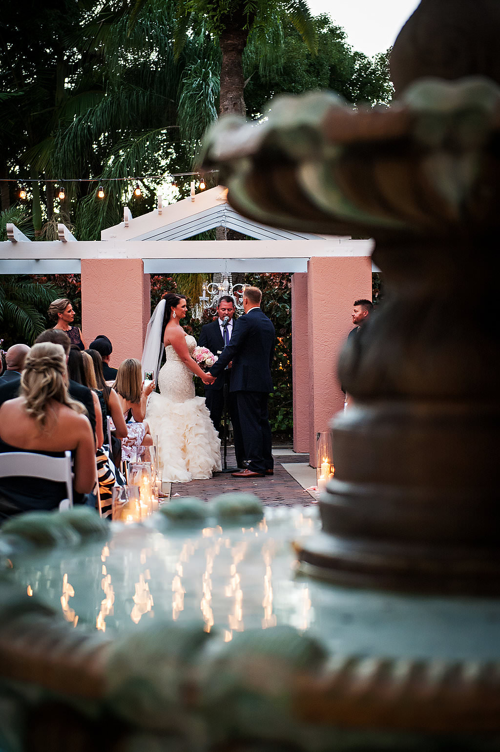 Outdoor Courtyard Wedding Ceremony Portrait with Pink Rose Petals | St Pete Wedding Photographer Limelight Photography | Tampa Bay Wedding Venue Vinoy Renaissance