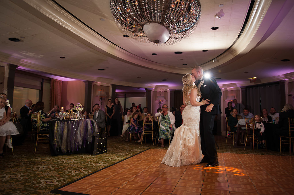 First Dance Portrait with Bride wearing Floral Lace Allure Bridal Wedding Dress and Groom in Black Tuxedo with Orchid Boutonniere | Tampa Bay Wedding Reception Venue The Tampa Club