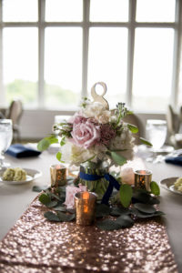 Rose Gold and Navy Wedding Reception Decor with Low Blush and Purple Rose Centerpiece with Greenery, Mercury Votives, and Sequined Table Runners | Tampa Bay Signature Event Rentals