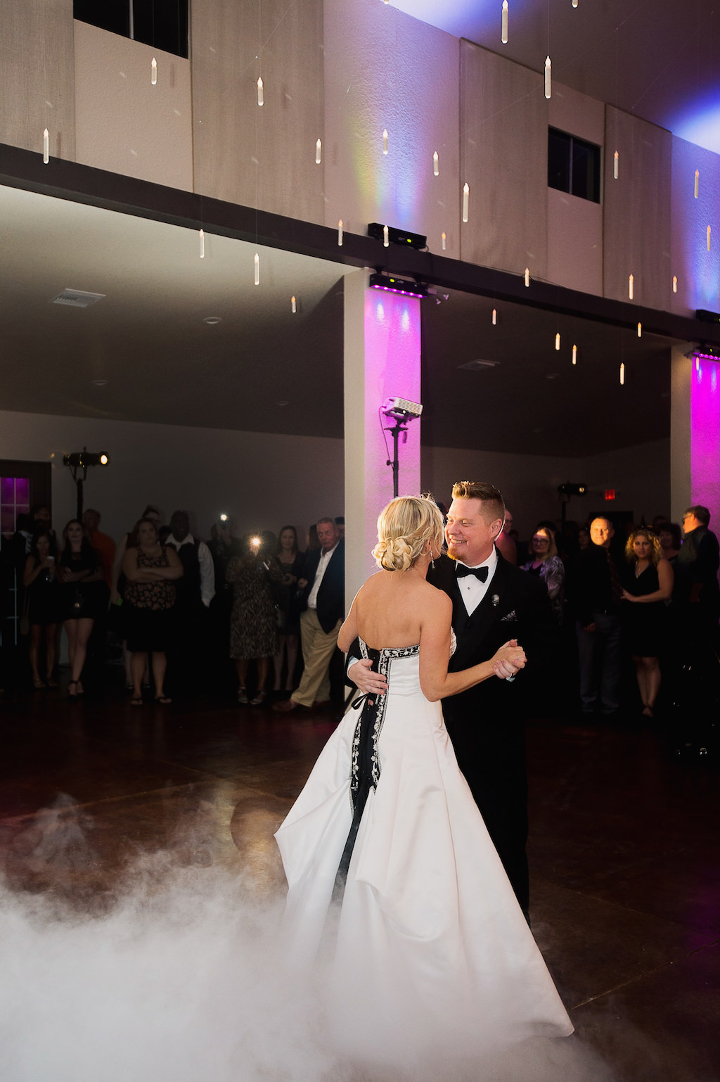 First Dance Portrait, Bride wearing Black and White A Line Strapless Wedding Dress | Sarasota Halloween Themed Wedding Smoke Fog by Nature Coast Entertainment Services