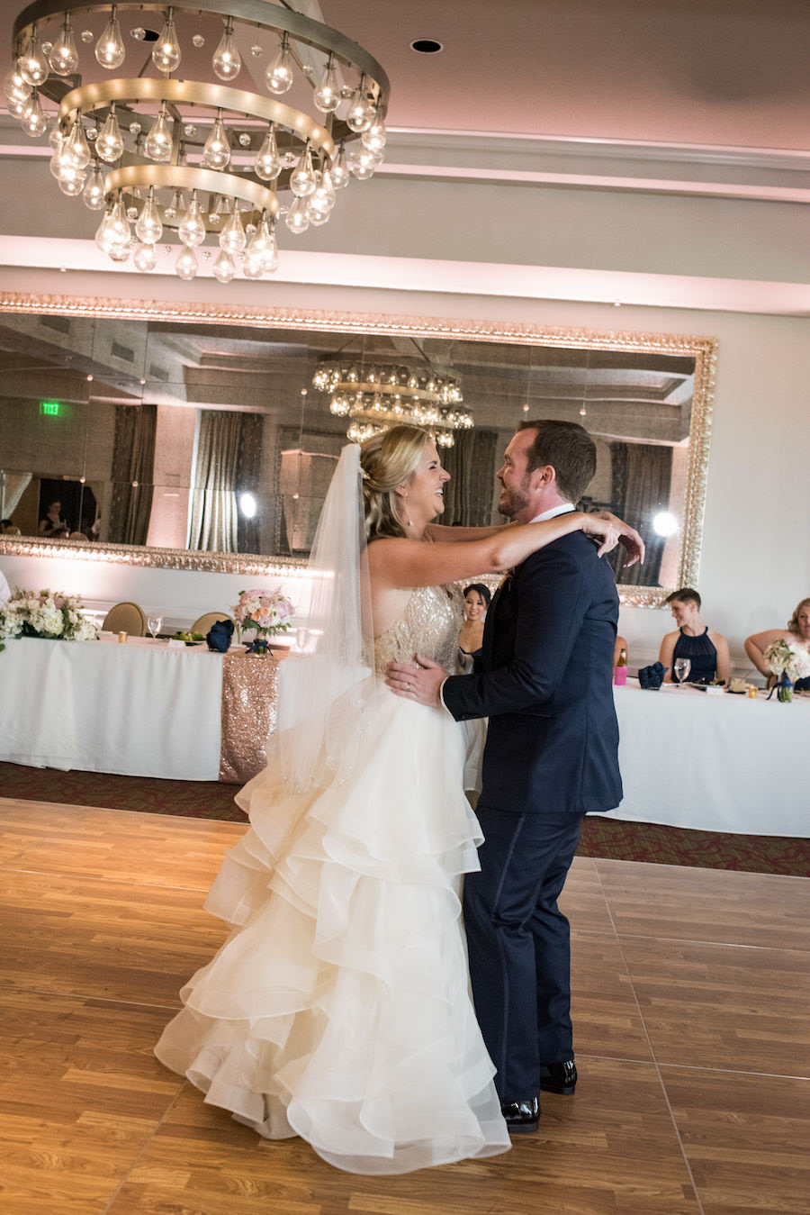 First Dance Portrait with Voluminous Layered Ball Gown Wedding Dress and Elegant Long Table at Downtown St Petersburg Reception Venue The Birchwood | Tampa Bay Wedding Planner Special Moments Event Planning