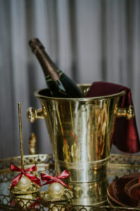 Gold Vintage Cocktail Hour Bar Cart and Champagne Station with Gold Cake Pop Favors | Tampa Bay Vintage Wedding Rentals Ever After Vintage Weddings | Wedding Dessert Bakery Pop Goes The Party