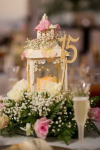 White and Pink Rose with Baby's Breath and Green Fern Centerpiece with Vintage Candle and Gold Numbered Table Marker | Tampa Bay Wedding Reception Decor
