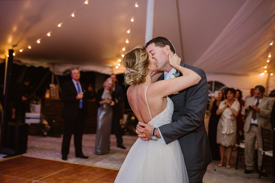 First Dance Portrait in Tented Outdoor Wedding Reception with String Lights