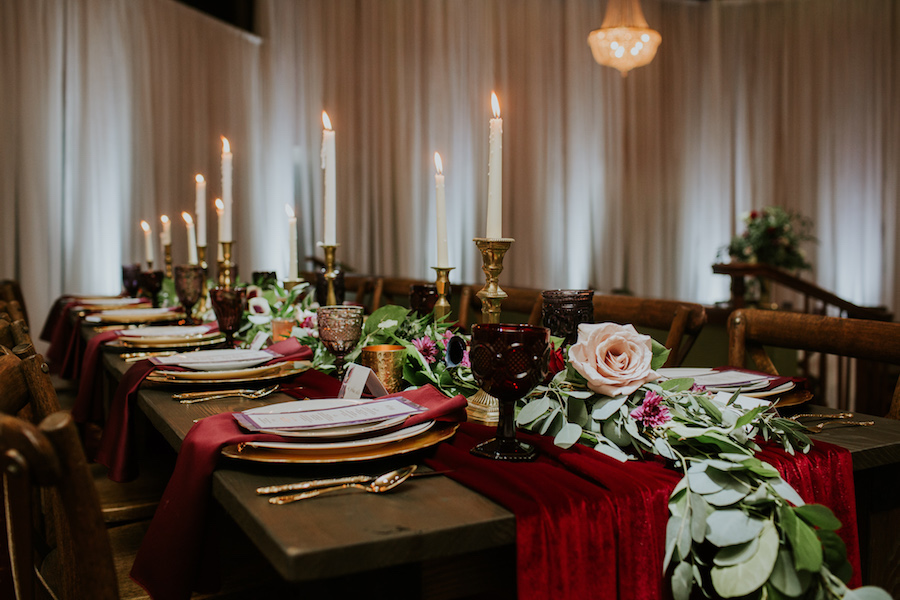 Romantic Vintage Glam Wedding Reception Centerpieces and Decor with Taper Candles Red Velvet Runner and Garland Florals | Planner Southern Glam Weddings & Events | Unique Tampa Bay Wedding Venue Safety Harbor Resort and Spa Theatre | Dish Rentals Ever After Vintage Weddings