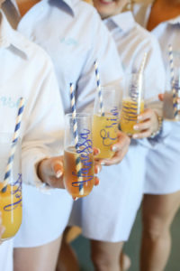 Wedding Getting Ready Photo with Bridesmaids in Nightshirts with Personalized Mimosa Glasses