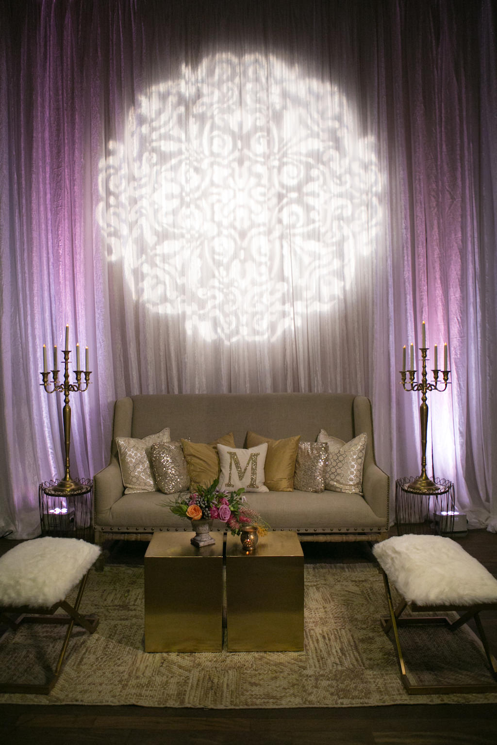 Stylish Wedding Lounge Decor with Modern Furnishings, Tropical Florals, and Purple Uplighting | St. Petersburg Wedding Venue NOVA 535 | Planner UNIQUE Weddings and Events