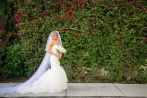 Outdoor Garden Bridal Portrait with Ivory Bouquet with Greenery wearing Sweetheart Mermaid Wedding Dress with Long Veil | Tampa Wedding Photographer Andi Diamond Photography