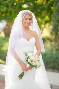 Outdoor Garden Bridal Portrait with Long-Stemmed Ivory Bouquet with Greenery wearing Sweetheart Mermaid Wedding Dress, Pearls, and Long Veil | Tampa Wedding Photographer Andi Diamond Photography