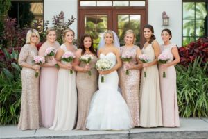 Outdoor Garden Bridal Party Portrait with Long-Stemmed Ivory and Pink Bouquet with Greenery wearing Sweetheart Mermaid Wedding Dress, with Mismatched Gold, Cream, and Blush Elegant Glam Long Bridesmaids Dresses | Tampa Wedding Photographer Andi Diamond Photography