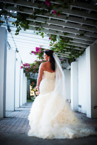 Outdoor Garden Bridal Portrait in Downtown St Pete with Layered Cathedral Train Blush Wedding Dress | Tampa Bay Wedding Photographer Limelight Photography