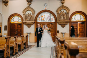 Traditional Church Wedding Ceremony Portrait with Orange and Greenery Tropical Bouquet, Stella York Wedding Dress with Layered Skirt | Downtown Tampa Wedding Photographer Rad Red Creative | Sacred Heart Catholic Church