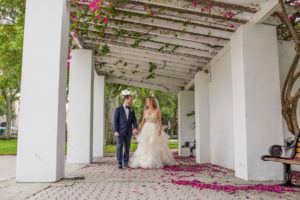 Outdoor Downtown St Petersburg Wedding Portrait with Cream Beaded Ball Gown Wedding Dress and Navy Blue Suit | Tampa Bay Ceremony Venue North Straub Park
