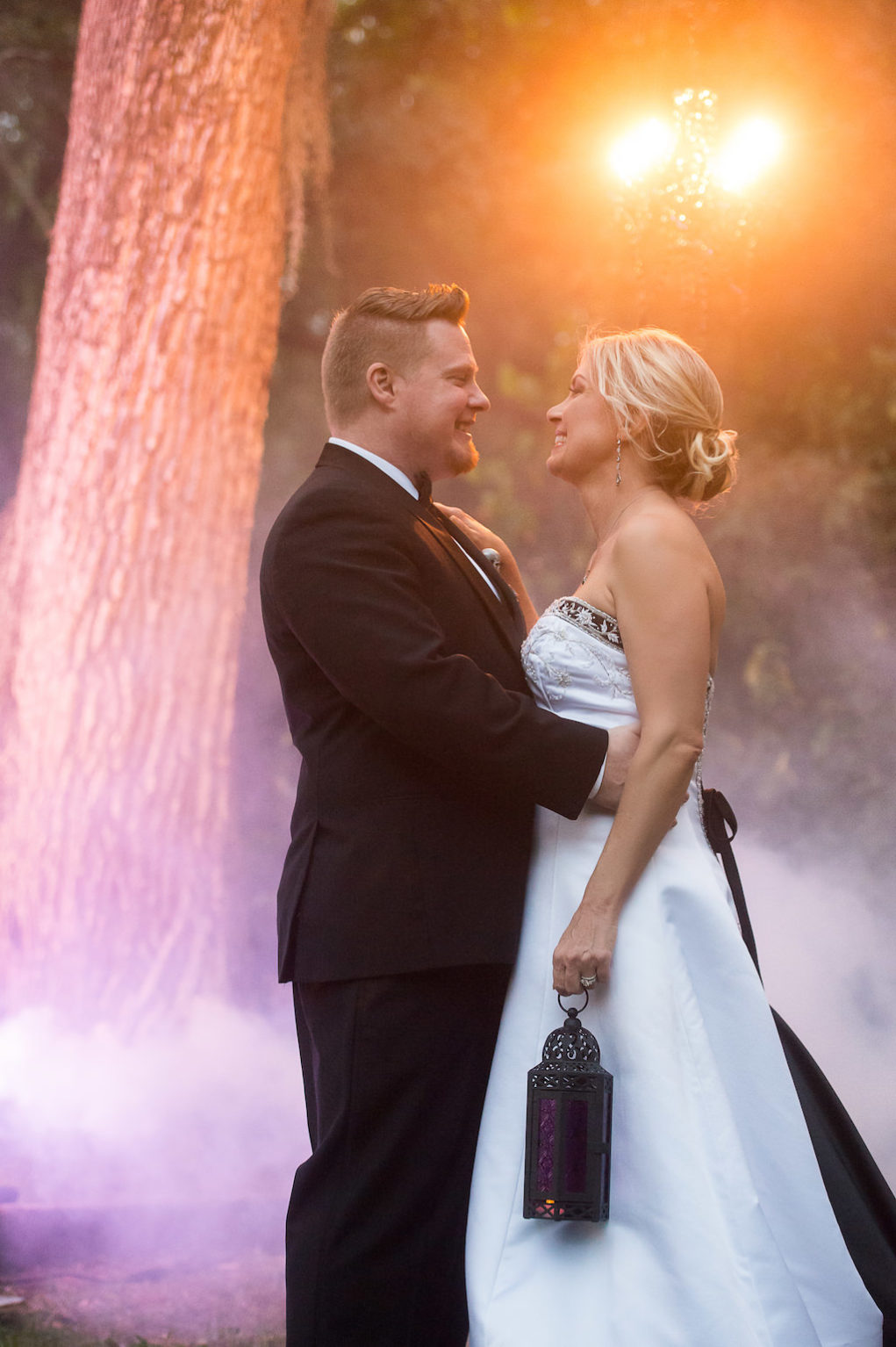 Theatrical Outdoor Wedding Portrait with Black and White Strapless Wedding Dress and Fog | Sarasota Halloween Themed Wedding Smoke Fog by Nature Coast Entertainment Services