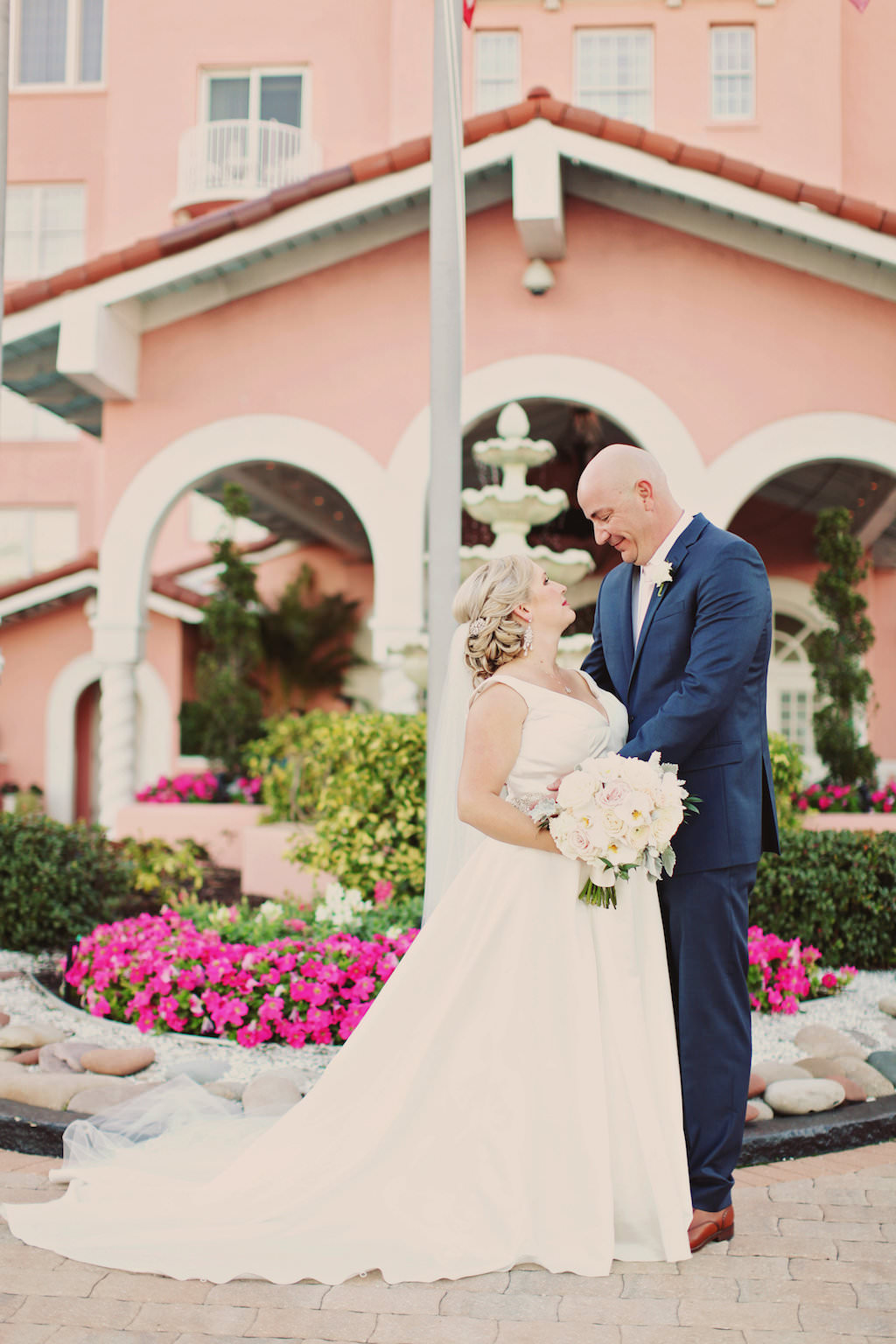 Bride and Groom Outdoor Wedding Portrait, Groom in Navy Blue Suit Bride with White Floral Bouquet | St Pete Beach Wedding Venue The Don CeSar