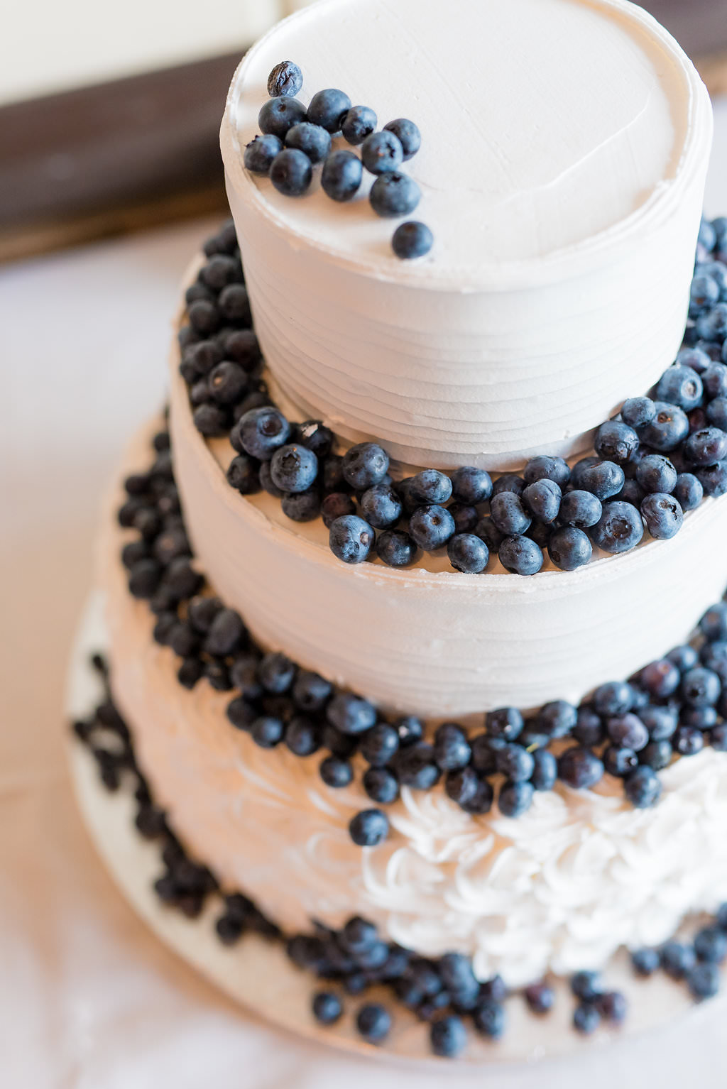 Round White Wedding Cake with Fresh Fruit Blueberries