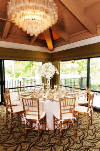 Gold Blush and Champagne Wedding Reception Table with Tall Centerpiece in Clear Glass Cylinder Vase and Gold Chiavari Chairs | Tampa Bay Wedding Venue Countryside Country Club