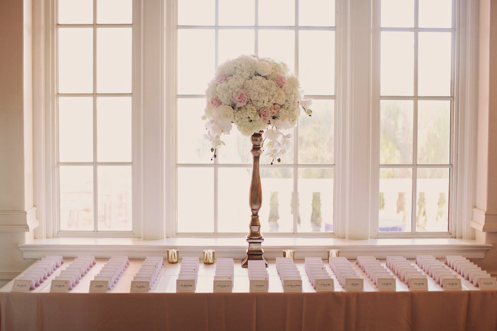 Tall White and Blush Rose and Orchid Flower Arrangement in Skinny Silver Vase with Blush Pink Printed Escort Cards | Tampa Bay Wedding Reception