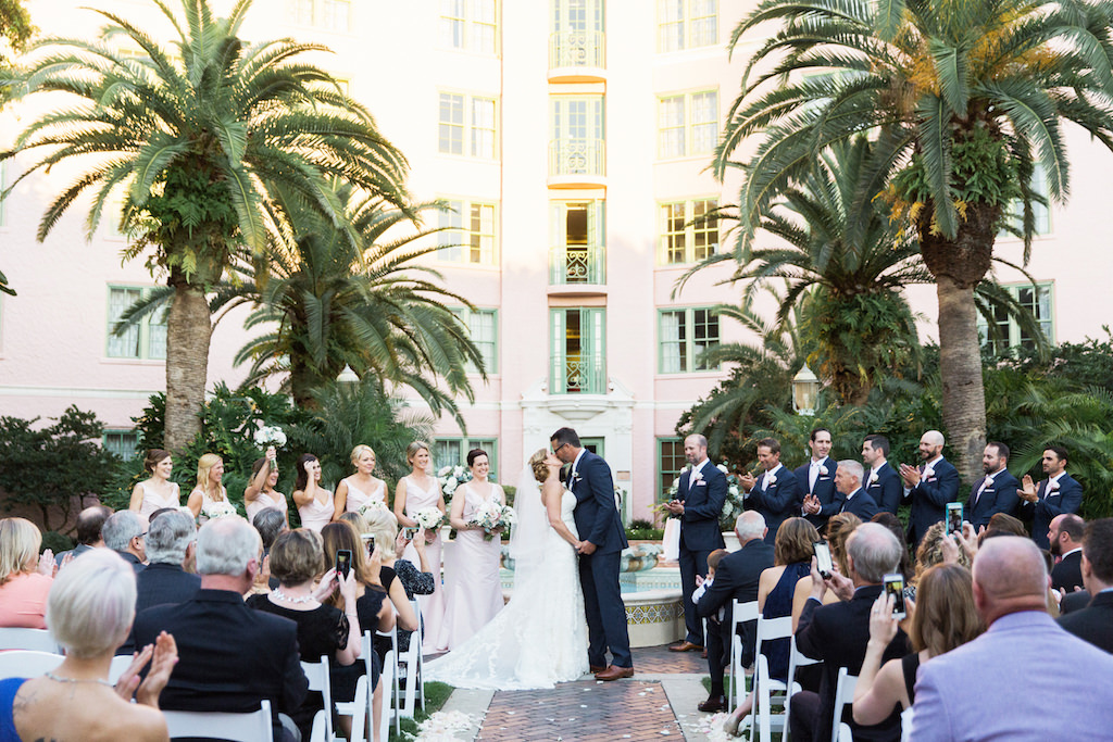 Outdoor Hotel Garden Courtyard Wedding Ceremony with Blush Bridesmaids Dresses and Navy Blue Groomsmen Suits | St Petersburg Art Deco Wedding Venue The Vinoy Renaissance