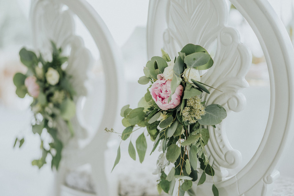 Rustic Wedding Reception Decor with Vintage White Chairs with Pink Peony and Greenery Flowers | Rustic Vintage Sarasota Wedding Rentals Kelly Kennedy Weddings and Events