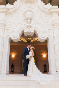 Bride and Groom Wedding Portrait on Front Steps of 1920s Architecture Tampa Bay Wedding Venue The Vinoy Renaissance