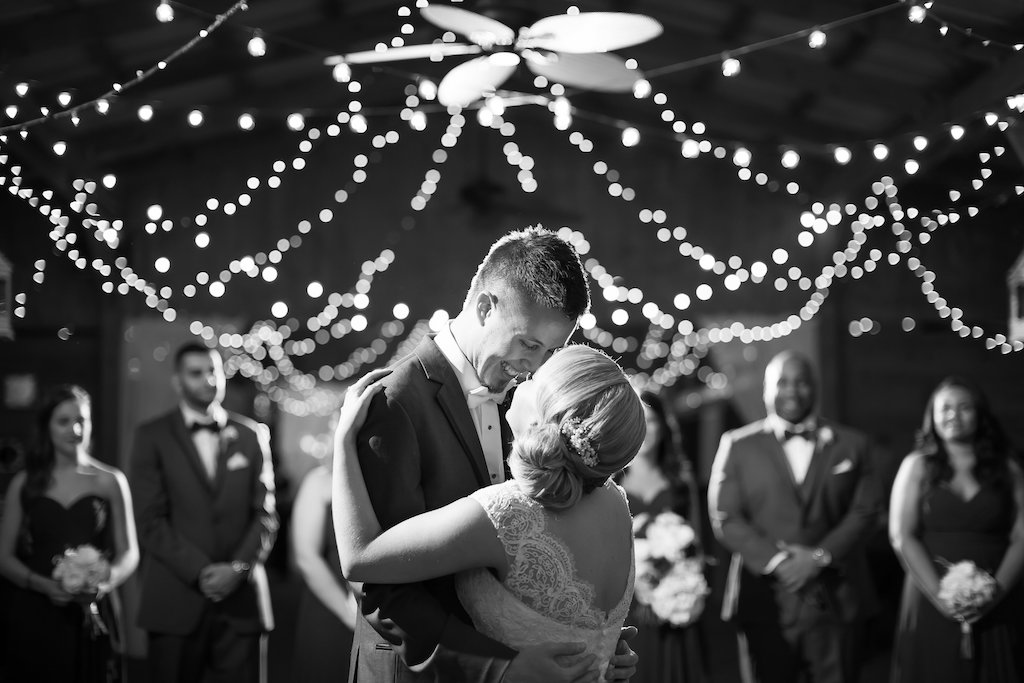 First Dance Portrait with String Lights in Barn Wedding Reception | Tampa Bay Wedding Photographer Rad Red Creative
