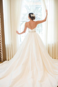 Bridal Portrait wearing Strapless Belted Wedding Dress with Royal Train