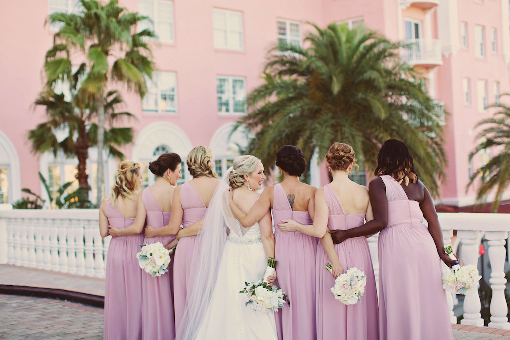 Bridal Party Portrait with Lilac Asymetrical One Shoulder Bridesmaids Dresses and White and Blush Bouquets | Tampa Bay Wedding Venue The Don CeSar