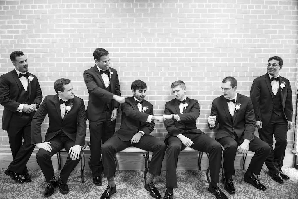 Indoor Groomsmen Wedding Party Portrait in Tuxedos with White Floral Boutonnière