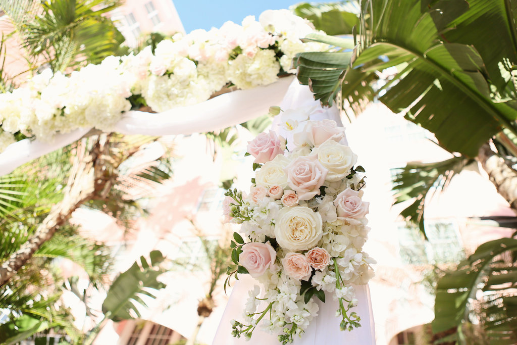Outdoor Wedding Ceremony Arch Decor with Blush Pink and White Rose with Greenery Flowers and White Drapery | Tampa Bay Wedding Planner Parties A La Carte