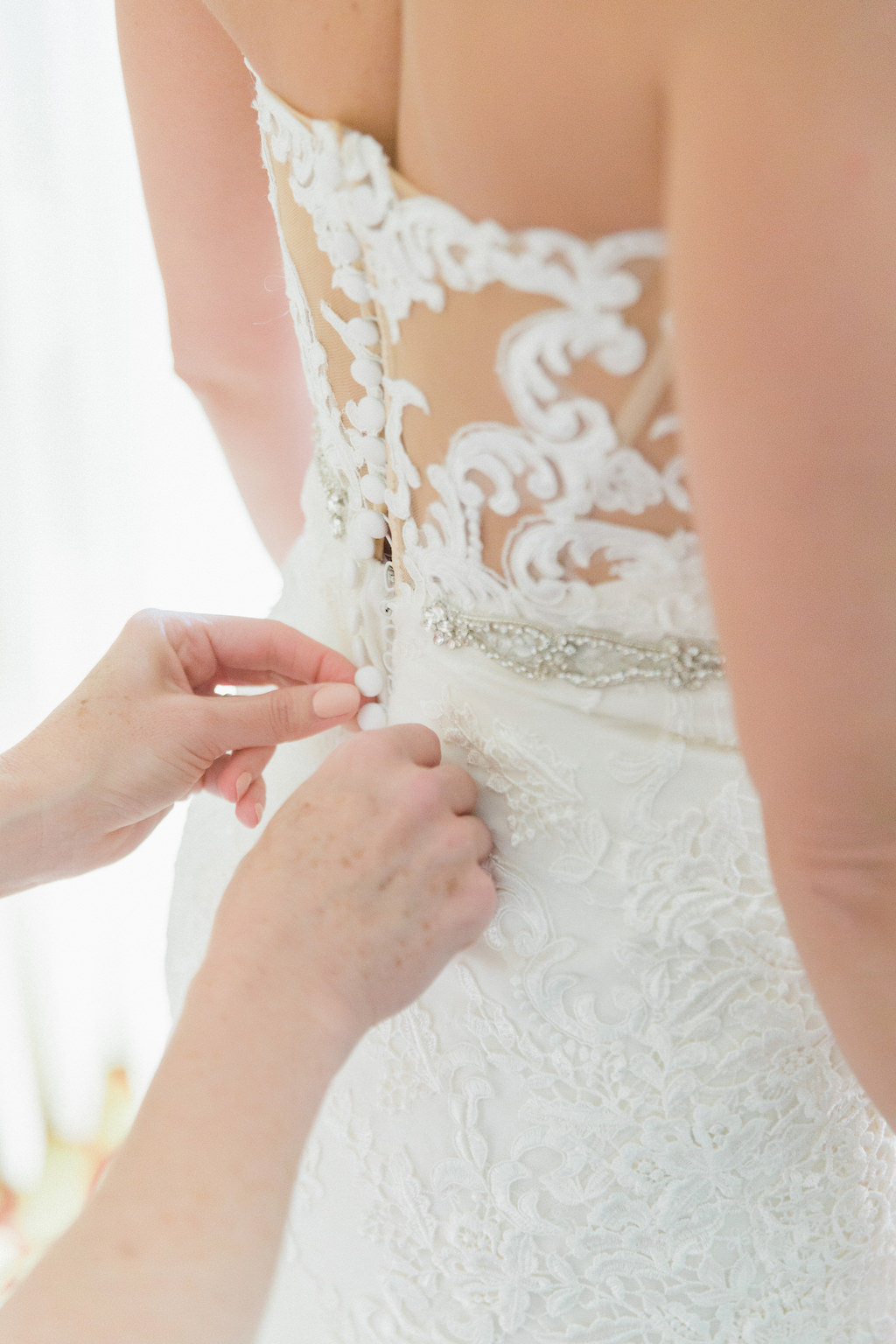 Bride Getting Ready Detail Portrait with Buttoned Back Lace Wedding Dress