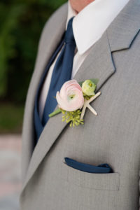 Nautical Inspired Groom Boutonniere with Pink flower and Starfish, wearing Gray Suit with Navy Blue Tie and Pocket Square