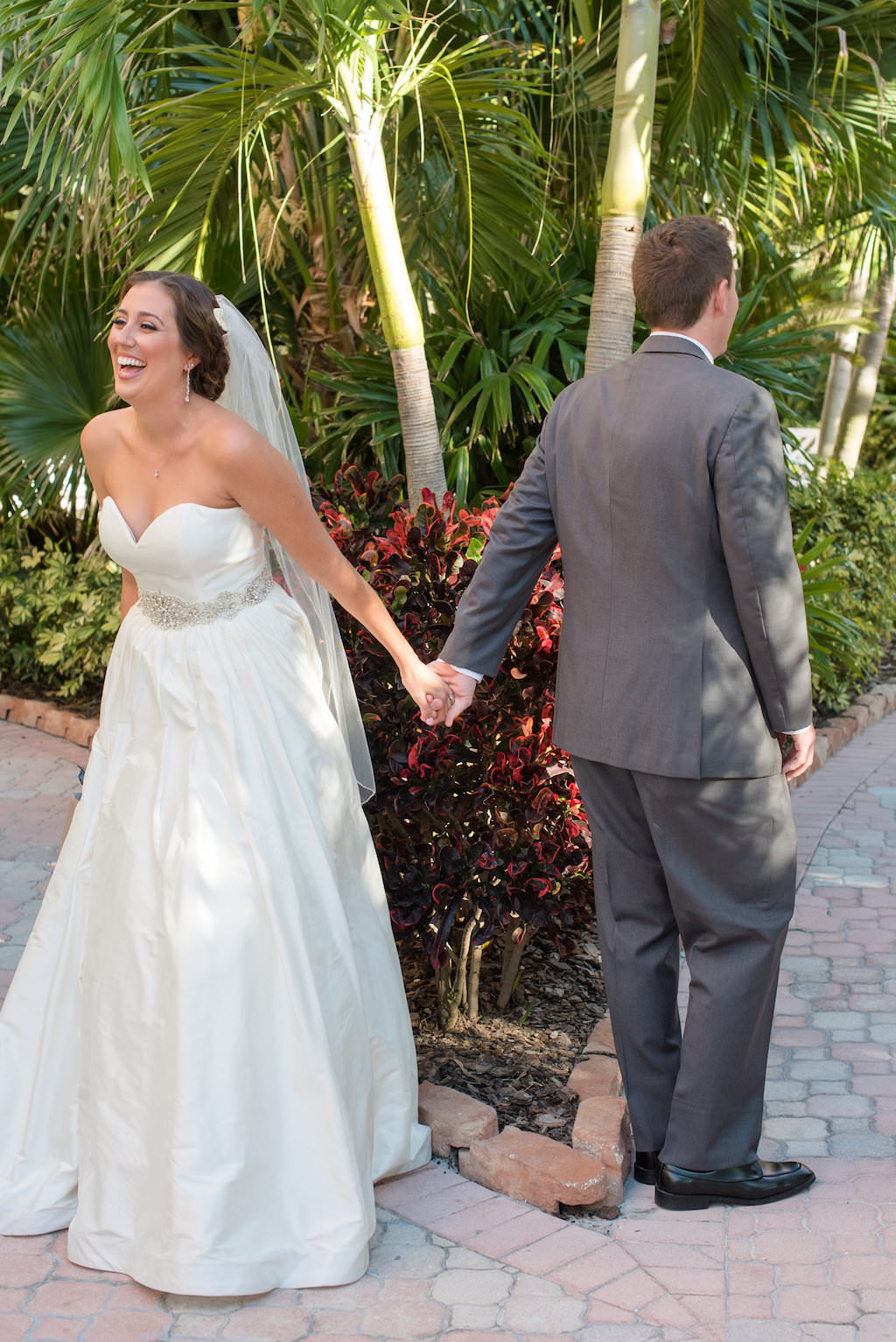 Outdoor First Look Portrait, Bride wearing Sweetheart A Line Silver Belted Wedding Dress | St. Pete Beach Wedding Photography Caroline & Evan Photography