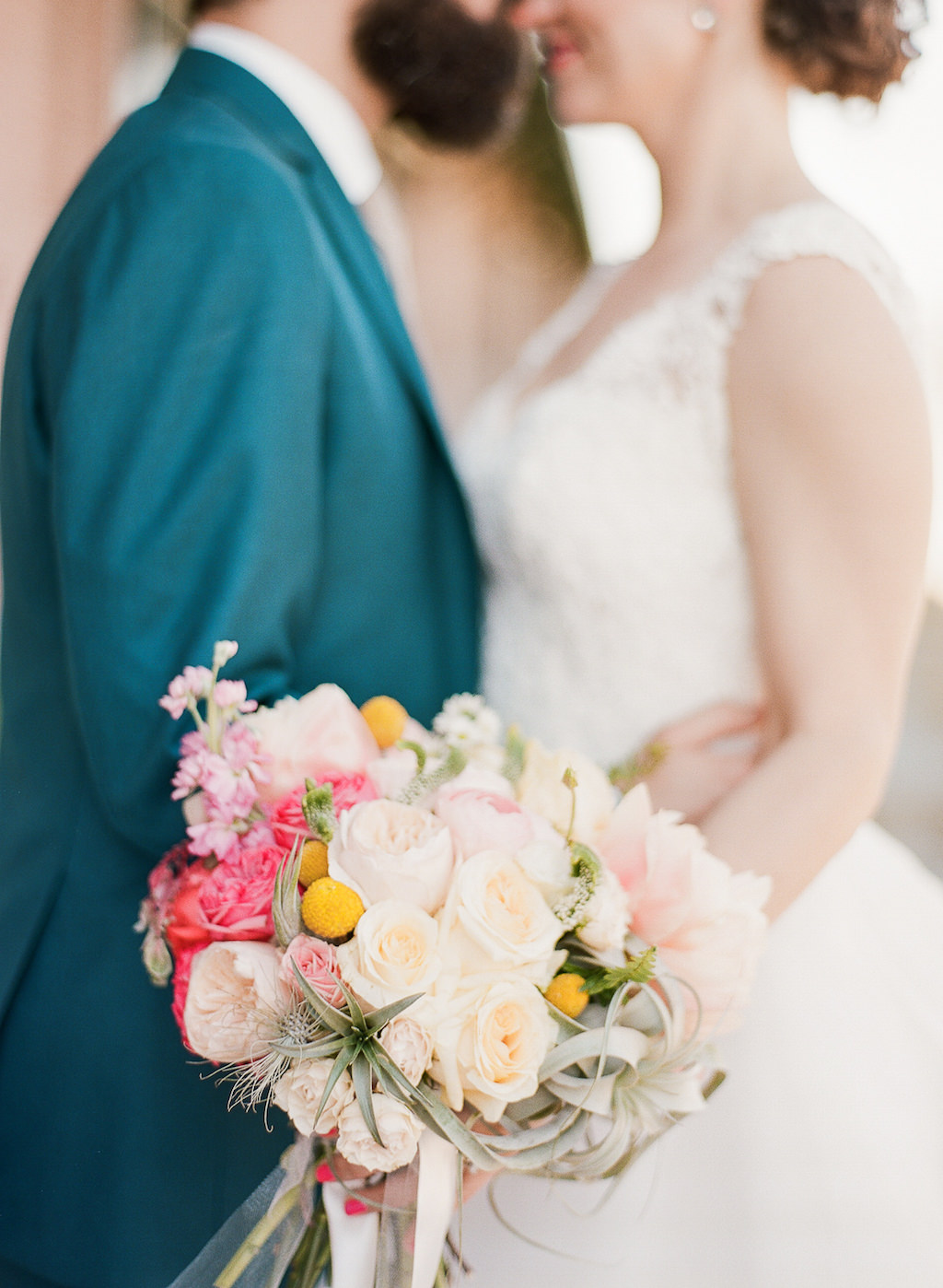 Bride and Groom Outdoor Wedding Portrait, Bride with Cream Rose, Blush Pink, Coral and Yellow Flower with Greenery Bouquet, Groom in Teal Suit