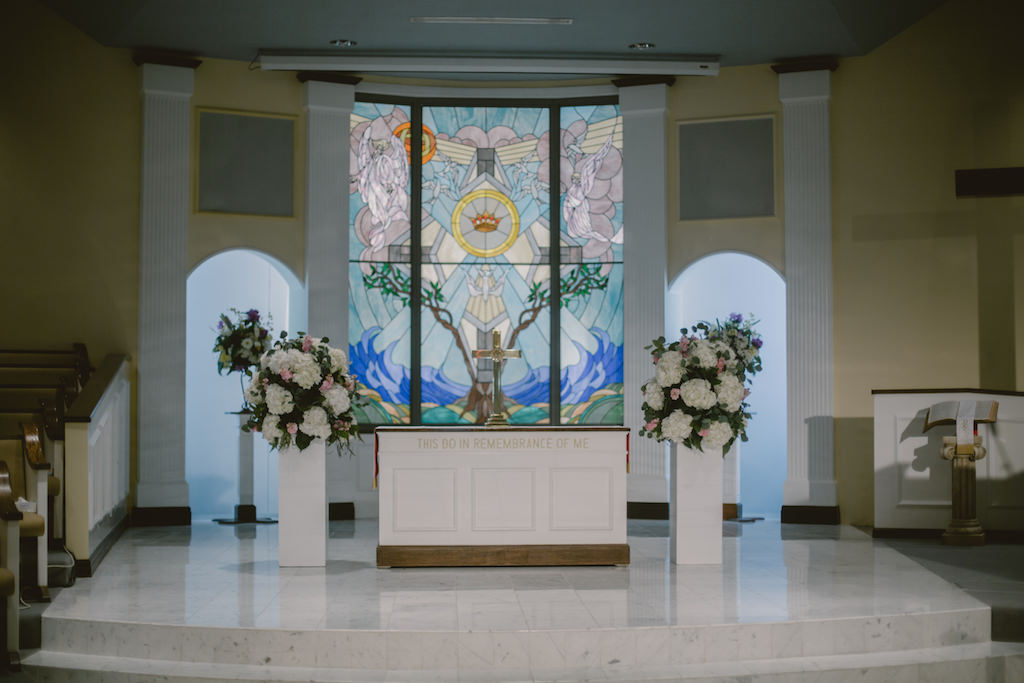 Traditional Church Wedding Ceremony Floral Decor with Large White Hydrangeas, Blush Roses and Greenery on White Pillars | St Pete Wedding Venue Northeast Presbyterian Church