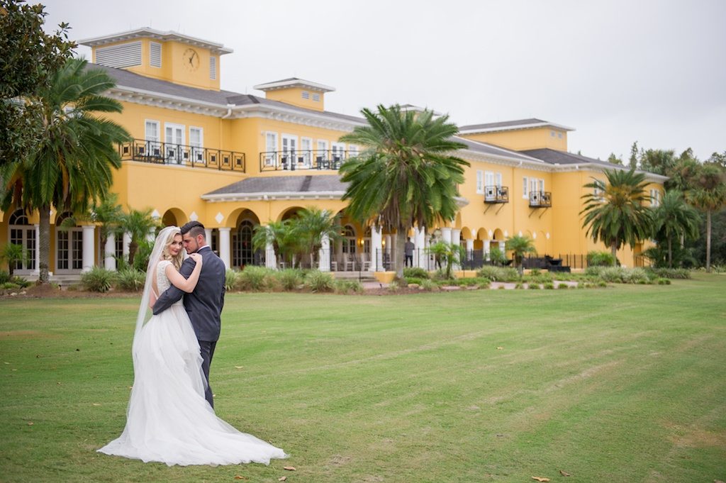Outdoor Garden Bride and Groom Wedding Portrait, Bride in Ballgown Wedding Dress from Tampa Bridal Boutique The Bride Tampa, Groom in Grey Tux | Tampa Bay Elegant Country Club Wedding Ceremony Venue The Tampa Palms Golf & Country Club | Tampa Wedding Photographer Andi Diamond Photography