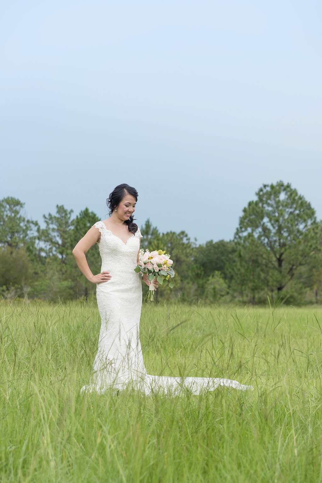 Outdoor Bridal Portrait with V Neck Stella York Wedding Dress and Yellow and White Bouquet with Greenery | Tampa Wedding Photographer Kristen Marie Photography