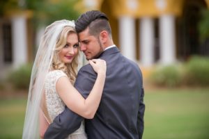 Outdoor Garden Bride and Groom Wedding Portrait, Bride in Open V Backed Lace Wedding Dress, Groom in Gray Tuxedo | Tampa Wedding Photographer Andi Diamond Photography | Tampa Bridal Hair and Makeup Michele Renee The Studio