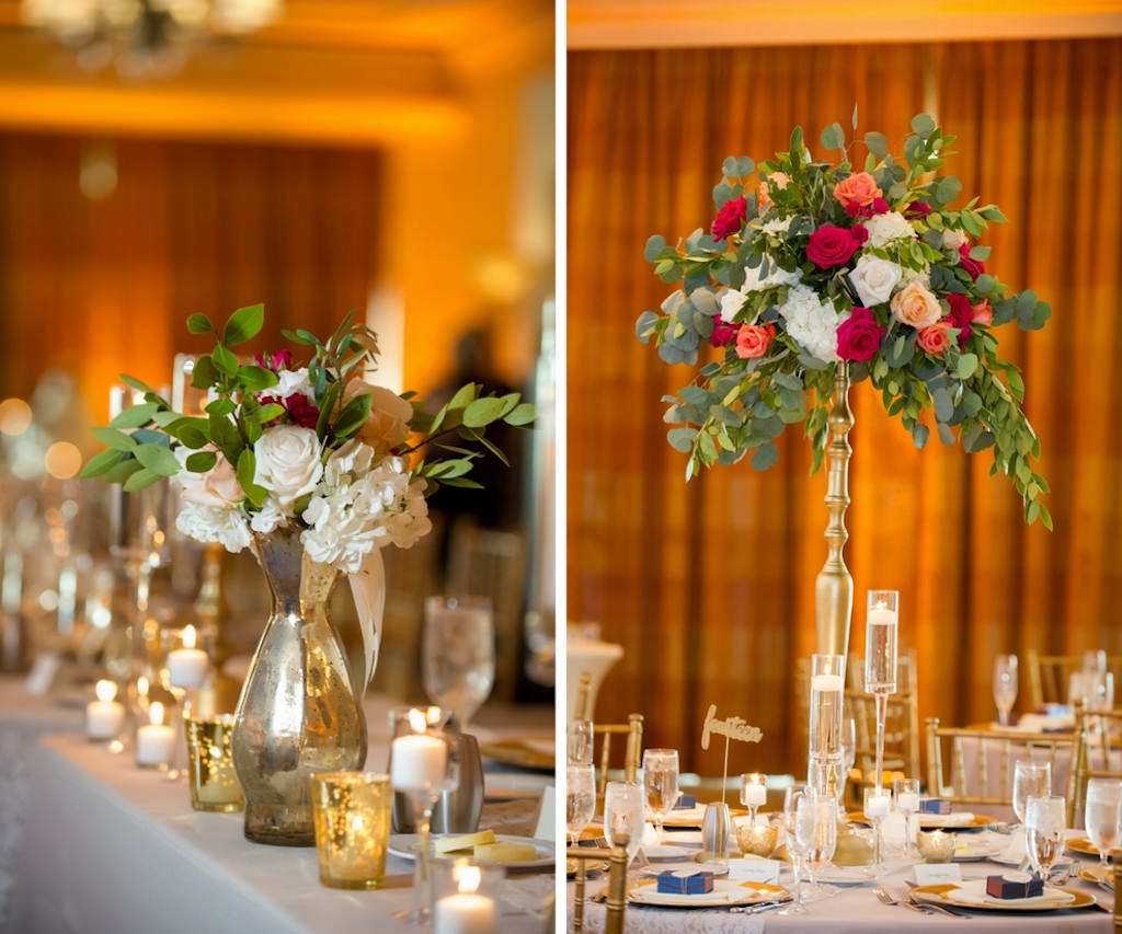 Old Florida Style Ballroom Wedding Table Decor with Tall Antique Gold and Silver Peach, Red, and White Rose with Greenery Centerpieces, and Gold Mercury Votive Candles