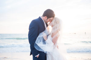 Boho Beach Wedding Portrait with Bridal Veil, Groom in Navy Blue Suit | Destination Hotel Wedding Venue Hilton Clearwater Beach