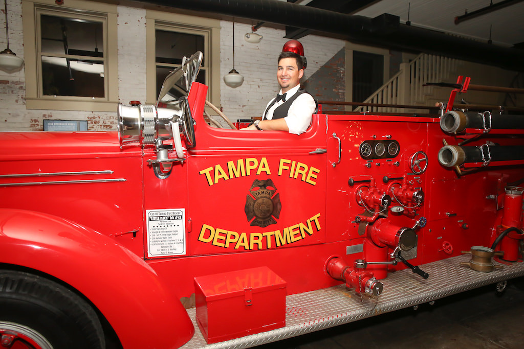Groom Portrait in Firefighter Truck | Tampa Historic Wedding Reception Venue The Tampa Firefighters Museum | Tampa Bay Wedding Photography Lifelong Studios