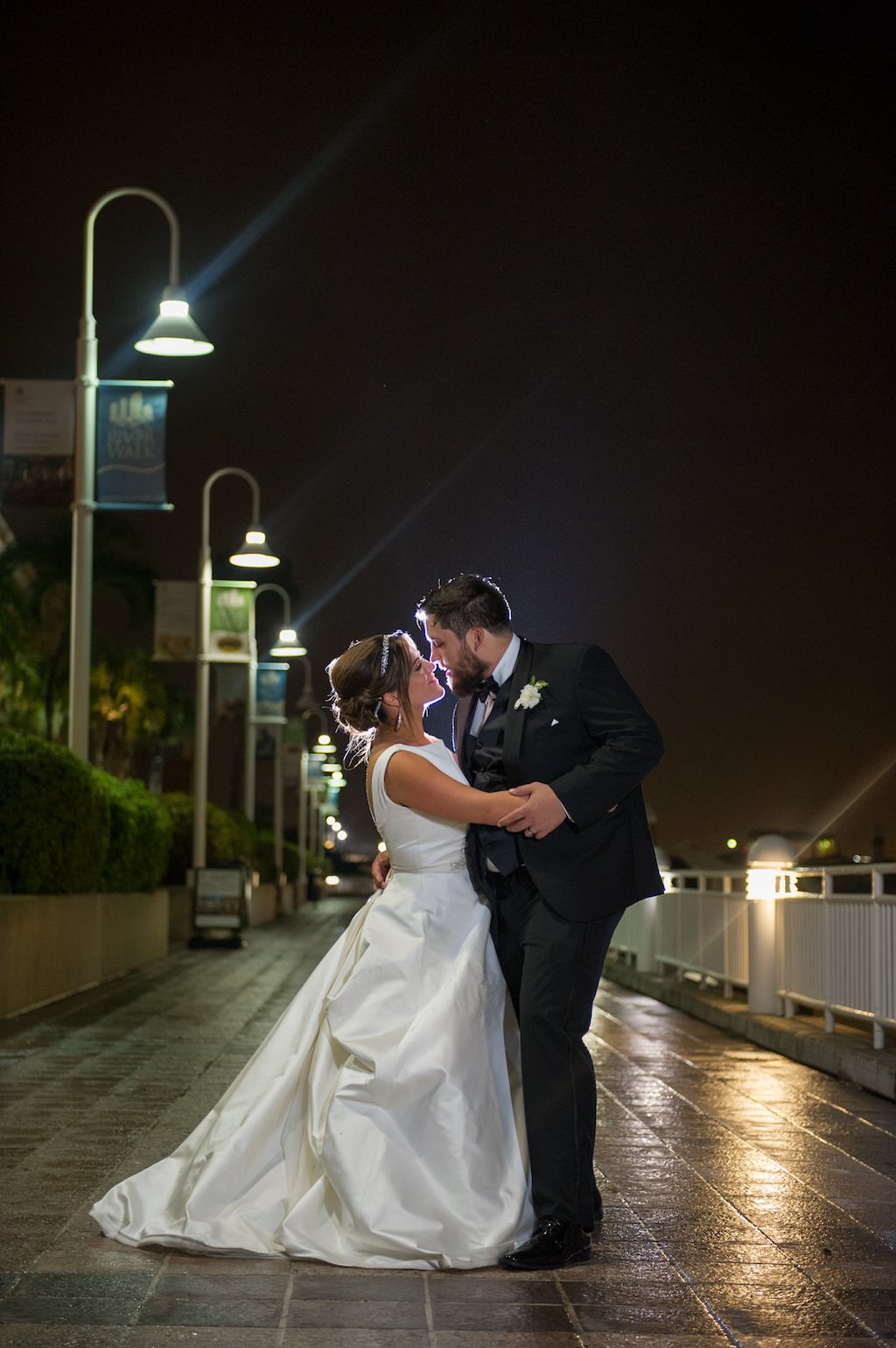 Outdoor Nighttime Downtown St Pete Bride and Groom Wedding Portrait, Bride in Belted Pronovias Wedding Dress | Tampa Bay Bridal Shop Isabel O'Neale Bridal | Tampa Wedding Photographer Andi Diamond Photography