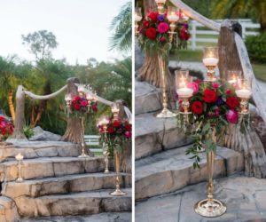 Elegant Inspired Southern Wedding Outdoor Reception Decor with Tall Candelabra with Hurricane Lanterns, Red Roses and Purple and Magenta Flowers with Greenery | Tampa Wedding Florist Northside Florist