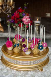 Gold, Purple, Pink, Navy Flower Cake Pops with Pearl Lollipop Sticks on Rhinestone Gold Cake Stand | Tampa Bay Wedding Desserts Sweetly Dipped Confections