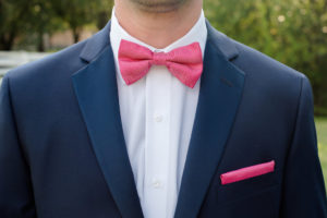 Groom Attire with Navy Blue Suit and Hot Pink Bowtie and Pocket Square