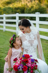 Outdoor Wedding Portrait with Red, Purple, and Greenery Bouquet and Flower Girl Floral Crown from Tampa Florist Northside Florist, in Daalarna Couture Illusion Lace Wedding Dress from The Bride Tampa | Hair and Makeup by Michele Renee The Studio | Caroline & Evan Photography