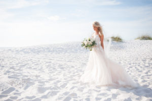 Outdoor Beach Bridal Portrait with Spaghetti Strap Ballgown Lace Monique Lhuillier Wedding Dress and White, Blush, and Greenery Wedding Bouquet | Clearwater Beach Boho Wedding