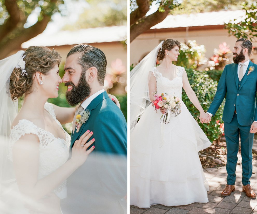Bride and Groom Outdoor Garden Wedding Portrait, Bride in Paloma Blanca Cathedral Train Wedding Dress with Coral Flower Bouquet, Groom in Teal Suit with Tropical Yellow and Pink Boutonniere